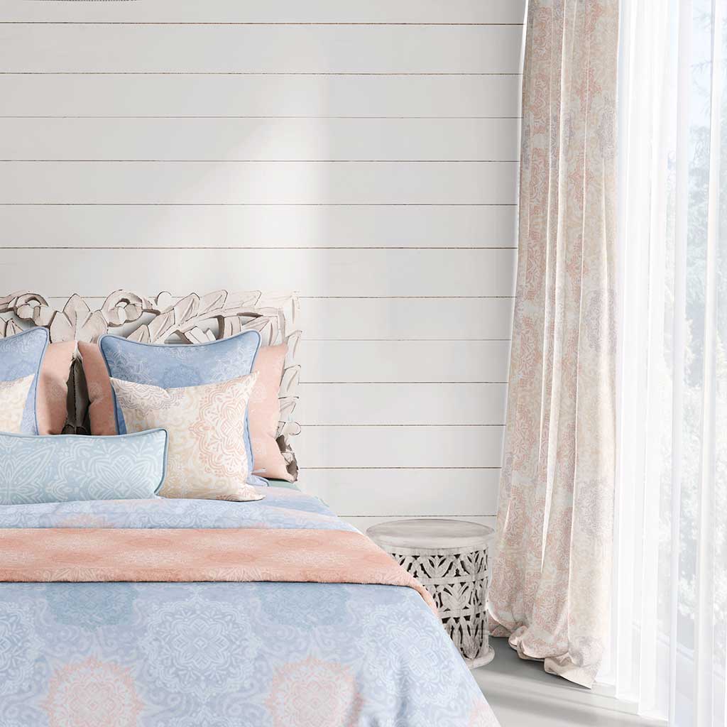 Example of a room with hand-drawn mandalas in peach and lavender colors on a cream background with a slight watercolor texture curtains.