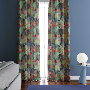 Example of a room with leaves on a dark blue background color curtains.