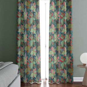 Example of a room with leaves on a teal background color curtains. 