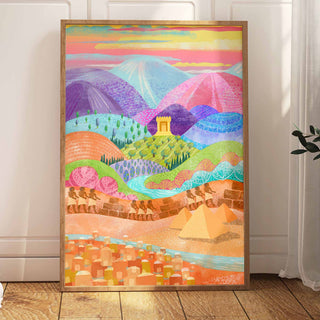 A framed colorful landscape art print leaning of the Exodus from Egypt. The artwork fof stylized mountains, hills, a tower, pyramids, and a city in bright pastel and saturated hues depicts the dream of the Promised Land to the Hebrews.