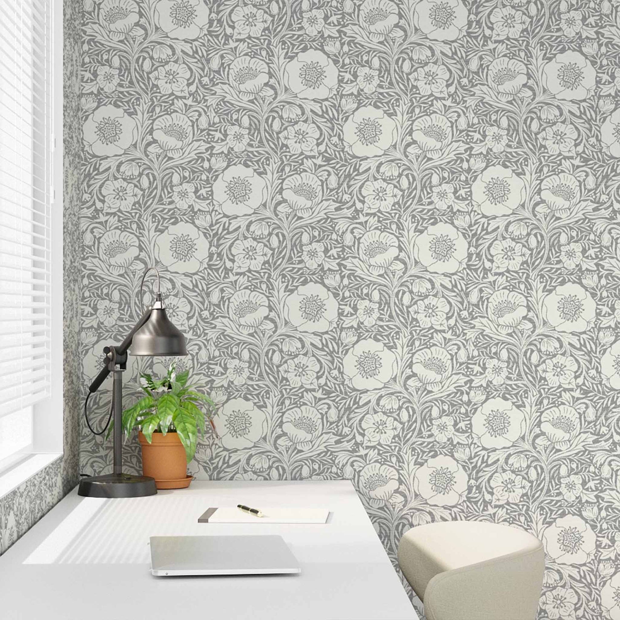 Wallpaper with fishing-themed design in a room with a desk and lamp.