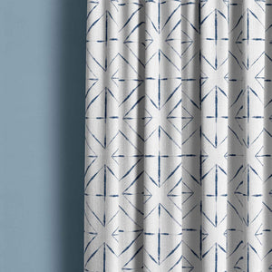 Detail of tie dye pattern curtain with large indigo diamond white.
