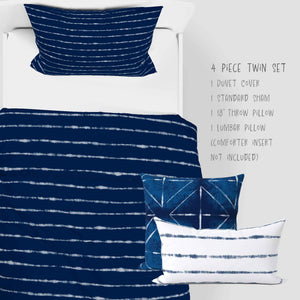 4 Piece Shibori Indigo Horizons in Blue bedding set. Set includes one shams, duvet cover, one 18 inch throw pillows and one lumbar pillow. Available in twin size.