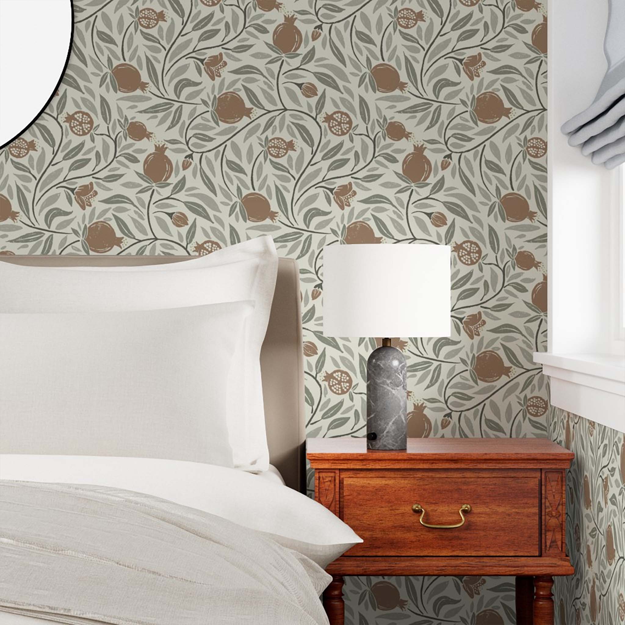 Woodcut Pomegranate fruit in Mocha and Sage is a subtle pattern for any space - shown here in a bedroom
