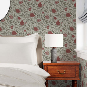 Red on Mocha Woodcut Pomegranate Fruit Wallpaper creates a soothing and subtle vibe in a bedroom