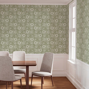 Sage color wallpaper in a dining room