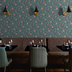 Woodcut Pomegranate fruit and leaves on dark teal background in a dining area